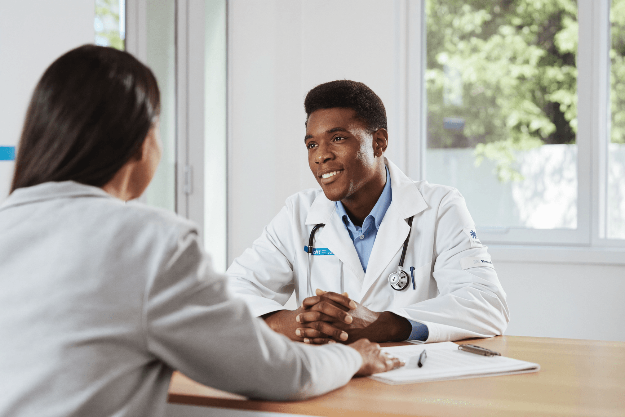 A provider consulting with a patient